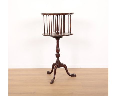 A GEORGE III STYLE MAHOGANY OCASIONAL BOOKCASEthe revolving upper section on a baluster turned stem to tripod base, 78cm high
