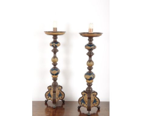 A PAIR OF BAROQUE STYLE PAINTED CANDLESTICKS19th century, decorated in blue and highlighted in gilt, on baluster turned stems