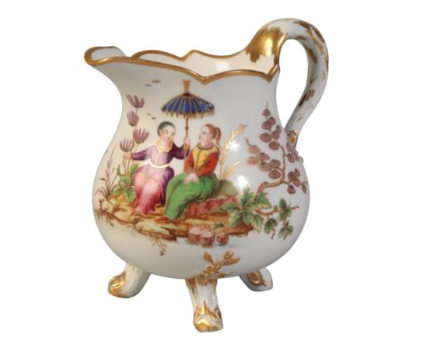 A SÈVRES HARD PASTE PEAR-SHAPED MILK JUG gilt marks and “Z” for 1778, painted by Lecot, with a branch formed handle and three