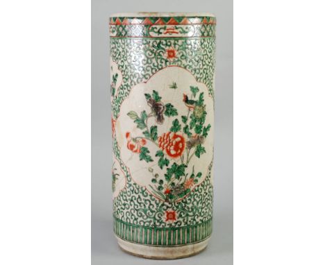 CHINESE FAMILLE VERTE ENAMELLED PORCELAIN STICK STAND, of typical cylindrical form, decorated with floral panels on foliate s