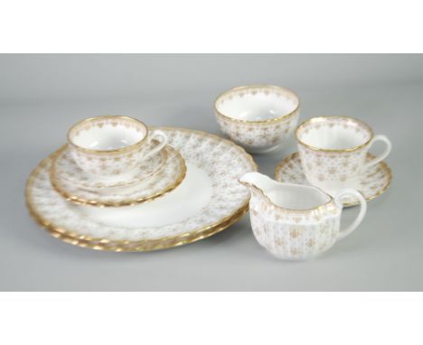 MODERN SPODE FLUTED CHINA TEA AND DINNER WARES, IN GILT FLEUR DE LYS PATTERN, viz 8 CUPS in two styles, 7 SAUCERS, 7 SIDE PLA