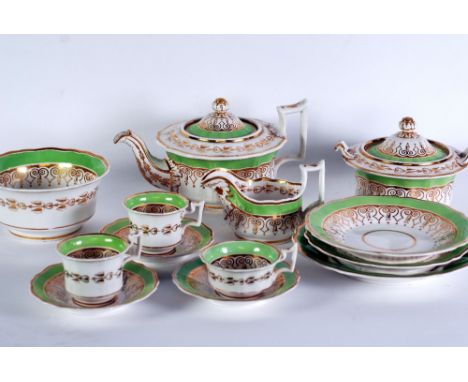 SIXTY ONE PIECE EARLY 19th CENTURY CHINA PART TEA SERVICE with lime green and gilt borders, comprising tea pot, milk jug, two