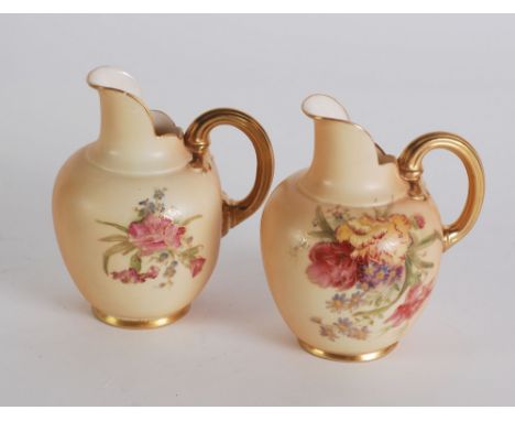 PAIR OF EARLY TWENTIETH CENTURY ROYAL WORCESTER BLUSH CHINA JUGS,  of ovoid form with moulded gilt handles and cut away spout
