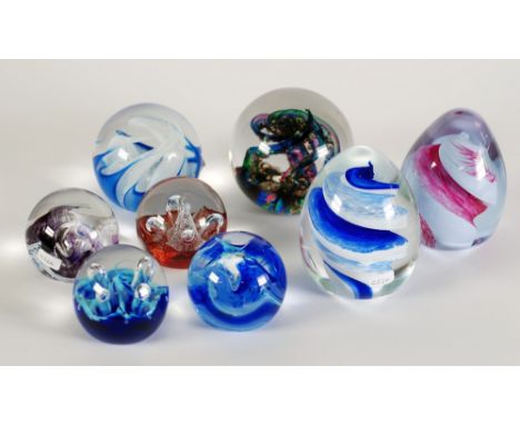 TWO CAITHNESS 'SWISH PATTERN' GLASS PAPERWEIGHTS, Cobalt and Cerise,  TOGETHER WITH FOR CAITHNESS SMALL PAPERWEIGHTS, 'Mooncr