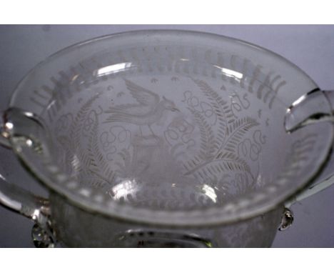 NINETEENTH CENTURY ENGRAVED GLASS LARGE TWO HANDLED LOVING CUP PATTERN BOWL, of campana form, wheel cut with a box and bird a