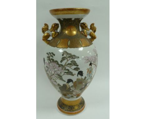 LATE NINETEENTH CENTURY JAPANESE KASUGA YAMA SEI PORCELAIN TWO HANDLED VASE, of footed ovoid form with moulded Shi Shi  patte