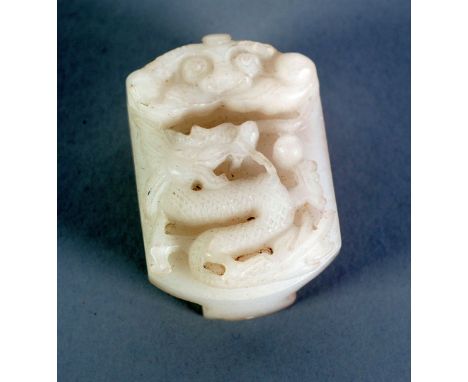 CHINESE CARVED WHITE HARDSTONE BUCKLE, of rounded oblong form, carved with a dragon, 2 1/8" x 1 1/2" (5.4cm x 3.8cm)  C/R Chi