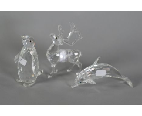 THREE SWAROVSKI CUT GLASS MODELS OF ANIMALS, Penguin, Dolphin and Stag, 3 1/4" (8.3cm) high and smaller (3)  C/R - Dolphin - 
