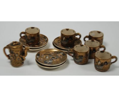 SET OF SIX JAPANESE MEIJI PERIOD MOULDED SATSUMA POTTERY TEACUPS AND SAUCERS,  painted with seated immortals and dragons,  TO