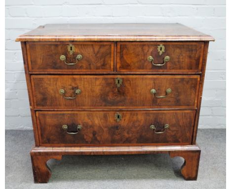A George I inlaid figured walnut chest of two short and two long graduated drawers on bracket feet, 96cm wide x 86cm high. 