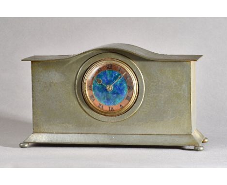 A Liberty &amp; Co mantel clock, No.01126, hammered pewter case with enamel dial, stamped marks to base, 17.7cm high x 32cm w