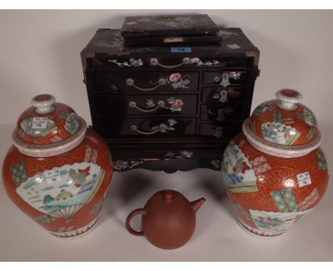 A 20th century Chinese black lacquer table top collector's chest with mother of pearl inlaid decoration, 27cm wide x 27cm hig