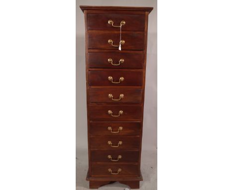 A 20th century mahogany tall chest of ten single drawers on bracket supports, 136cm high x 46cm wide x 39.5cm deep. 