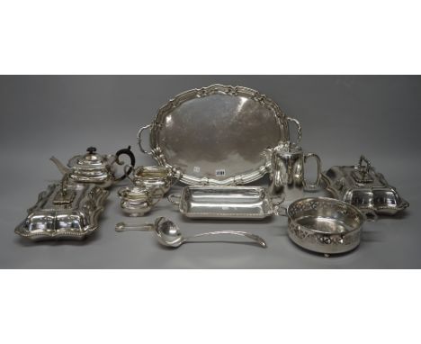 A group of plated wares, comprising; a three piece tea set with a shaped oval twin handled tray, a pair of shaped rectangular