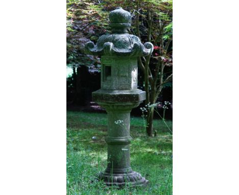 A Japanese carved stone garden lantern, 19th/20th century, on pedestal, 174cms high.