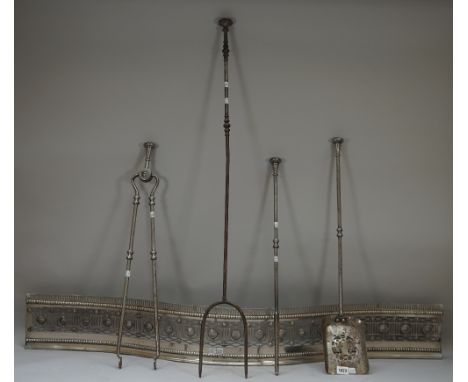A set of three Victorian steel fire irons, with knopped shafts and a matching log fork, the later 104cm and a serpentine fend