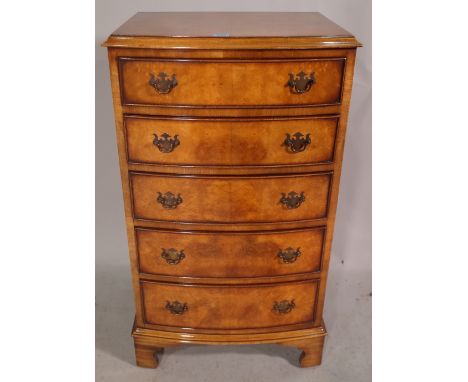 A George III style walnut chest of five graduated drawers on bracket feet, 53cm wide x 94cm high. 