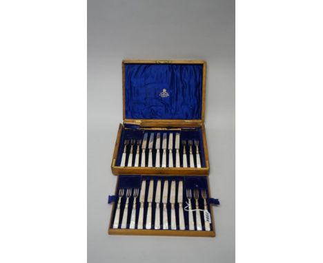 A 24 piece cased set of silver and mother of pearl handled fruit knives and forks, mostly Sheffield 1918 (a.f). 