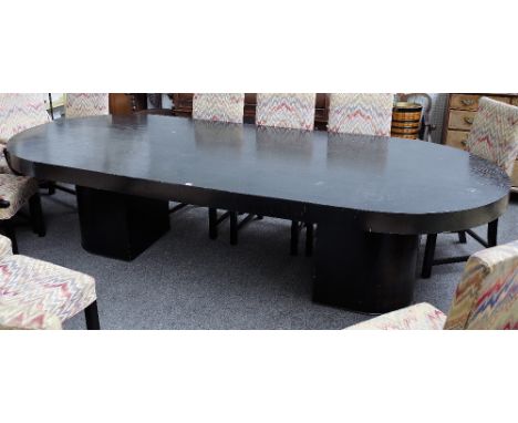 A large Art Deco style ebonised ash dining table with rounded rectangular top on a pair of pedestals, 129cm wide x 305cm long