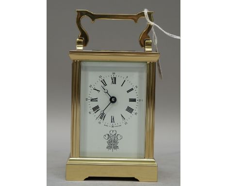 An English brass carriage timepiece, 20th century, presentation engraving of His Royal Highness Prince of Wales feathers, ret