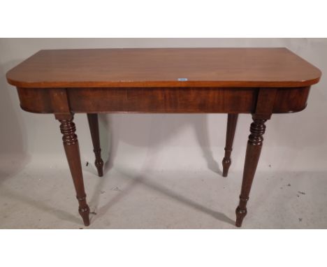 A Victorian mahogany console table on ring turned tapering supports, 120cm wide x 73cm high. 