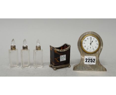 An Edwardian silver mantel timepiece, maker's mark RP, Birmingham, 1909, of waisted outline with enamel dial and Arabic numer