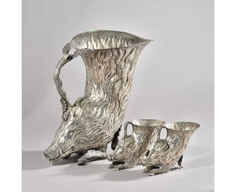 A set of three Italian silver-plated boar form rhytons, retailed by Christian Dior, tallest 27cms high, smaller pair 9.5cms h