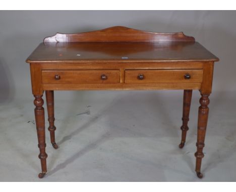 A Victorian mahogany two drawer side table,  with galleried back on ring turned supports. 