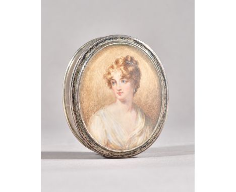 A silver oval box and cover, glazed to the cover with the portrait miniature of a lady with pale brown curly hair, wearing a 