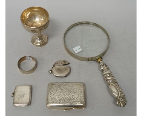 Silver and silver mounted wares, comprising; an Edwardian circular vesta case, Chester 1909, a rectangular vesta case, a ciga