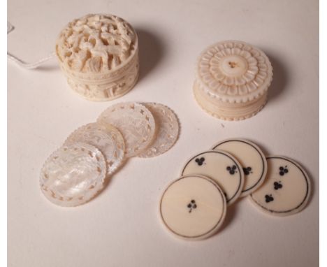 A small Canton ivory gaming counter cylindrical box and cover, late 19th/early 20th century, carved with two figures, pavilio