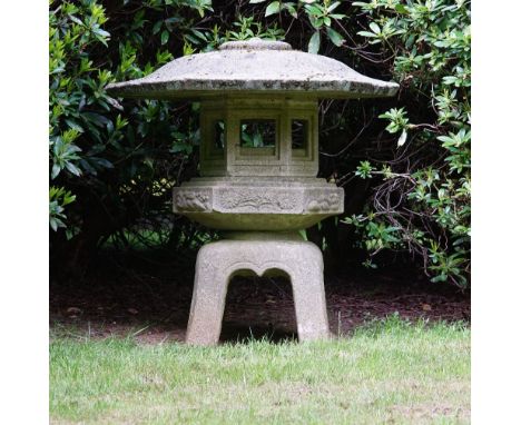 A Japanese carved stone hexagonal garden lantern, 20th century, 126cms high.