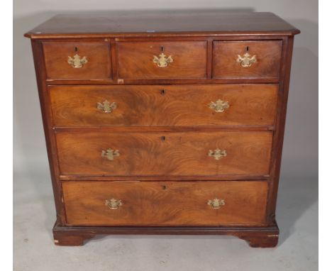 A George III mahogany chest of three short and three long graduated drawers with canted fluted edges on bracket feet, 118cm w