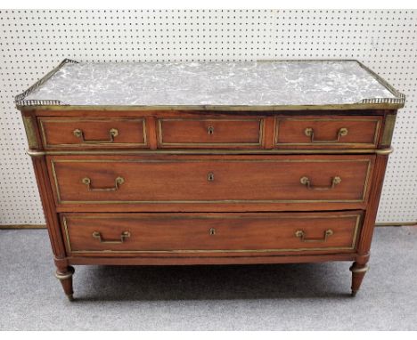 A 19th century French commode, the rectangular marble top over a gilt metal mounted mahogany three drawer base on turned supp