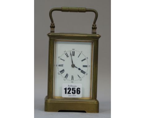 A French brass cased carriage clock, late 19th century, with visible platform escapement, single train movement and enamel di