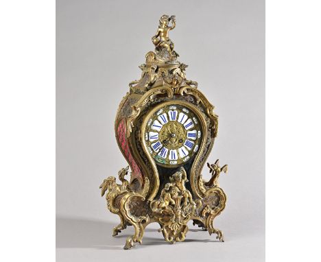 A Louis XV style boulle work bracket clock of waisted form, with cherub finial, enamelled Roman numerals, glazed pendulum ape