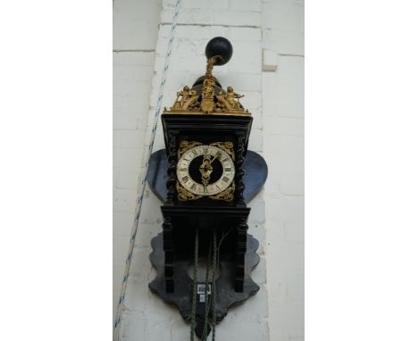 A Dutch 'Zaan' wall clock, 18th/19th century, with ebonised shaped oak case and quarter striking movement, four graduated bra