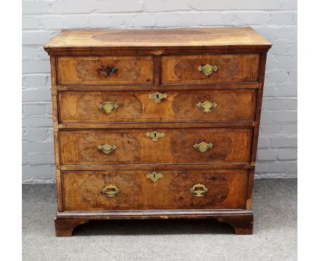A George I figured walnut and burr yew chest, with two short and three long graduated drawers, on bracket feet, 94cm wide x 9