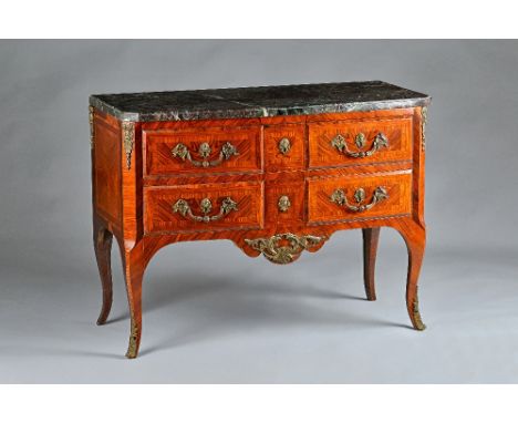 A Louis XV style commode, the marble top over a gilt metal mounted kingwood base with two short and one long drawer on cabrio