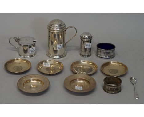 Silver and foreign wares, comprising; a muffineer of cylindrical form with a scroll handle, London 1961, a near pair of small