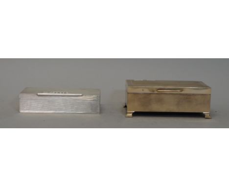 A silver cigarette box, of rectangular form, with all over reeded decoration and tubular thumbpiece, Birmingham 1961, weight 