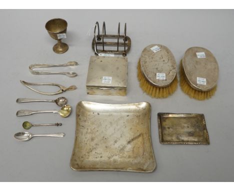 Silver and silver mounted wares, comprising; a pair of oval hairbrushes, Birmingham 1921, a square cigarette box, wooden line