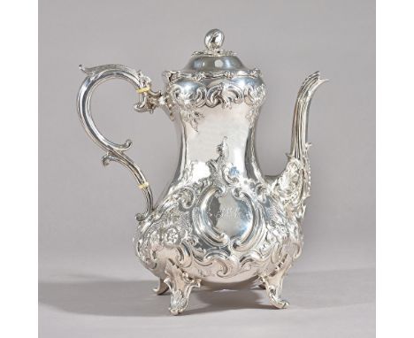 A Victorian silver coffee pot, of baluster form, the hinged lid with a melon form finial, with a scrolling handle, the body w