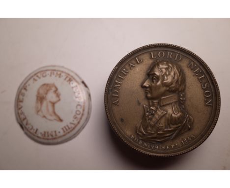 A 19th century gilt brass snuff box of circular form, made to commemorate the Death of lord Nielson, 6cm wide and a concave e