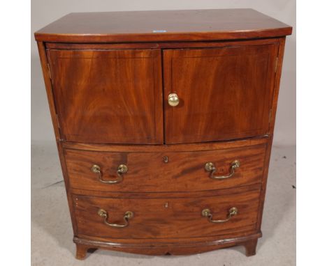 A George III mahogany bowfront commode/side table, with lift top over two dummy drawers, 65cm wide x 75cm high. 