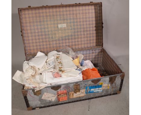 A travel trunk, 90cm wide x 37cm high containing mainly 20th century fabric. 