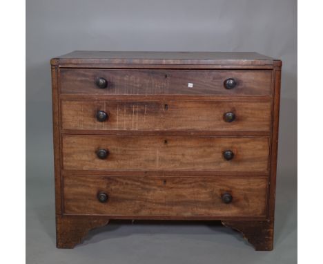 An early 19th century mahogany and ebony strong chest of four long graduated drawers on bracket feet, 97cm wide x 85cm high. 