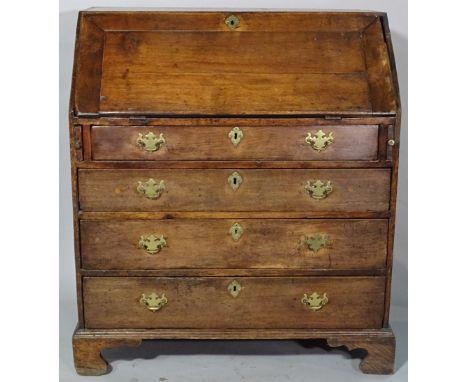 An 18th century and later oak bureau of four long graduated drawers on ogee bracket feet, 92cm wide x 104cm high. 
