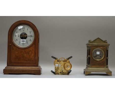 A Bulle patent mantel clock, early 20th century, the domed oak inlaid case enclosing an unusual movement, 36cm high; a mahoga