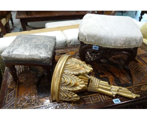 A Victorian oak framed shaped foot stool, 36cm wide x 23cm high, together with another foot stool and a gilt wall bracket. 